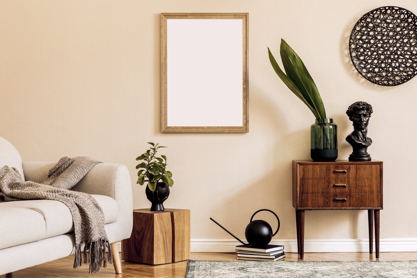 Design scandinavian home interior of living room with mock up poster map, stylish wooden commode, cube, sofa, flowers in vase and elegant personal accessories. Modern home staging. Template. Japandi.